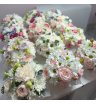 Цветочная композиция из кустовых роз, эвкалипта, хризантем и гвоздик